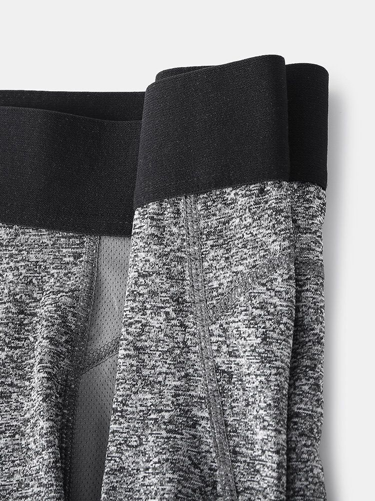 Enfärgad Stretch Slim Snabbtorkande Mesh-genen Sport Fitness Shorts